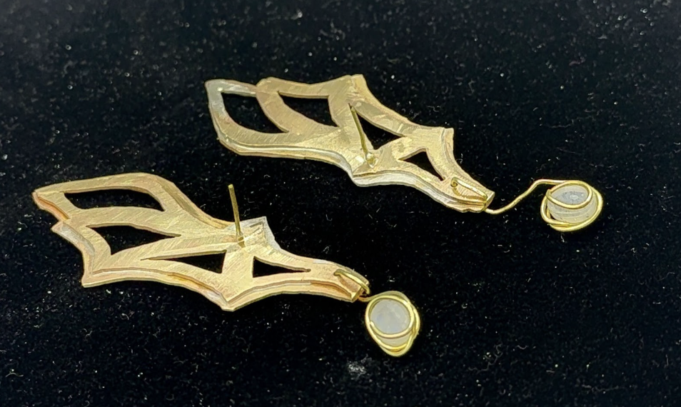 Prototype — back view showing structural detail and moonstone bezel